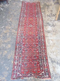 Persian runner, in red, carpet is 9'6" by 31.5"