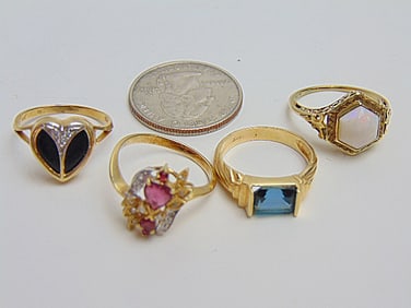 Jewelry. (4) GOLD rings 14kt to include blue emerald cut gemstone 3.45 grams, size 6; white opal w/