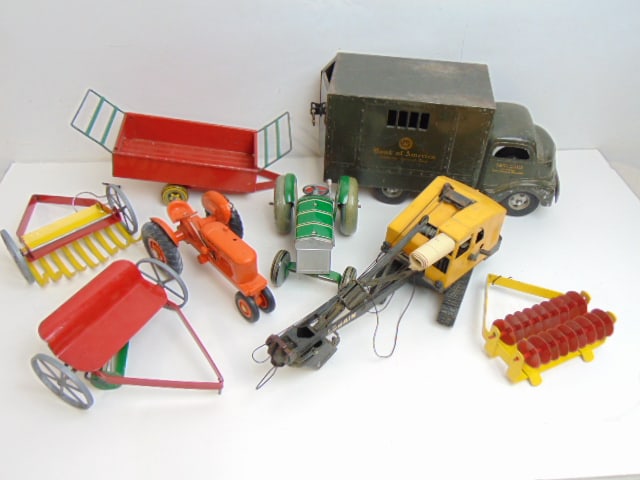 4 toy trucks, Bank of America truck, Lorain shovel, tractor, several accessories (1 of 5)