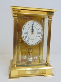 Brass clock by Bulova, "Howard Thurston JR, 30 years' service, Texaco 1988, quartz