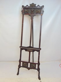 Carved easel, folding & adjustable, has carved lion, various carved panels, easel is 78.5" tall as s