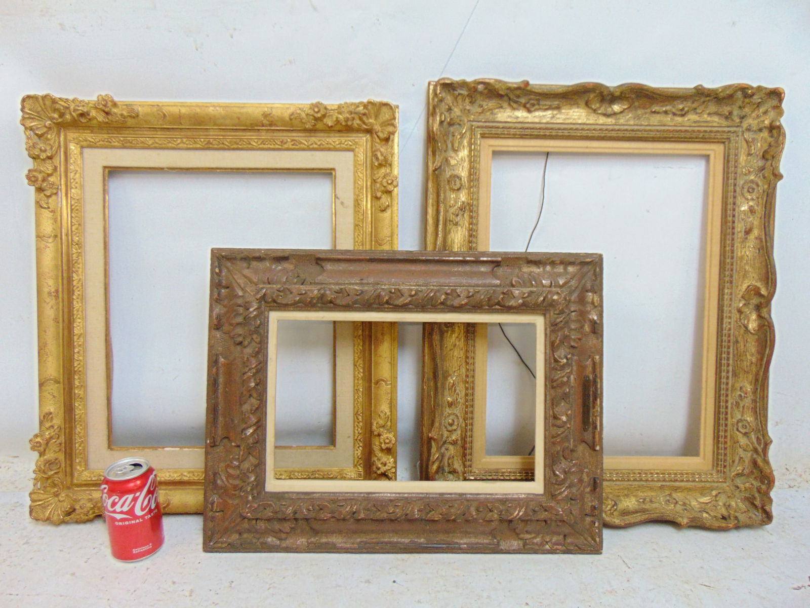 3 carved frames with linen lining, openings are 14.25" by 9" ; 16.75" by 13.5" & 18.25" by 13 1/8": 3 carved frames with linen lining, openings are 14.25" by 9" ; 16.75" by 13.5" & 18.25" by 13 1/8"