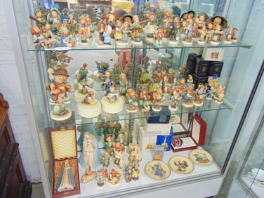 Large collection of Hummel's, figurines, lidded boxes, bells and a large selection of still boxed co