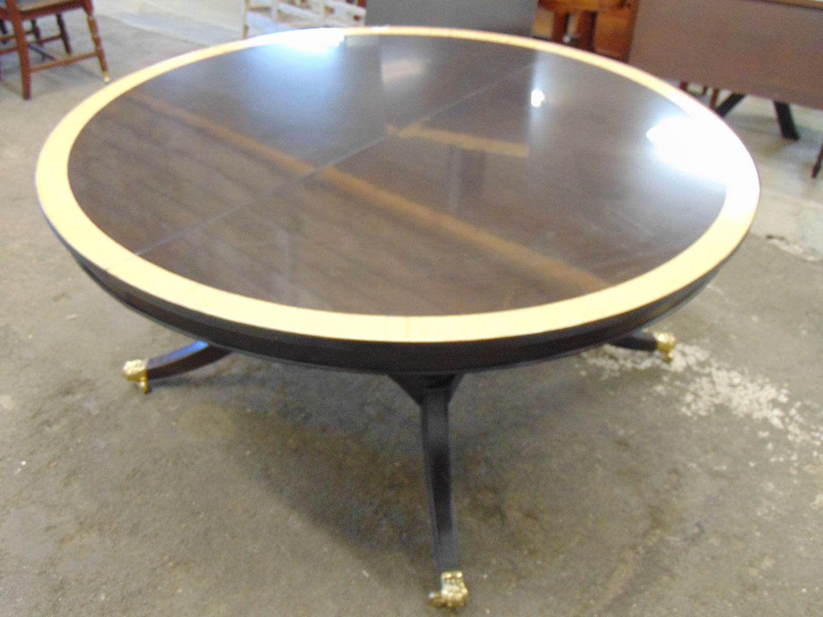 Round dining table with large leaf possibly by Baker, banded inlaid edge, brass capped feet (1 of 11)