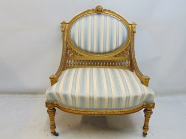 French gilt arm chair with striped upholstery, carved detail on back, arms, good condition, upholste