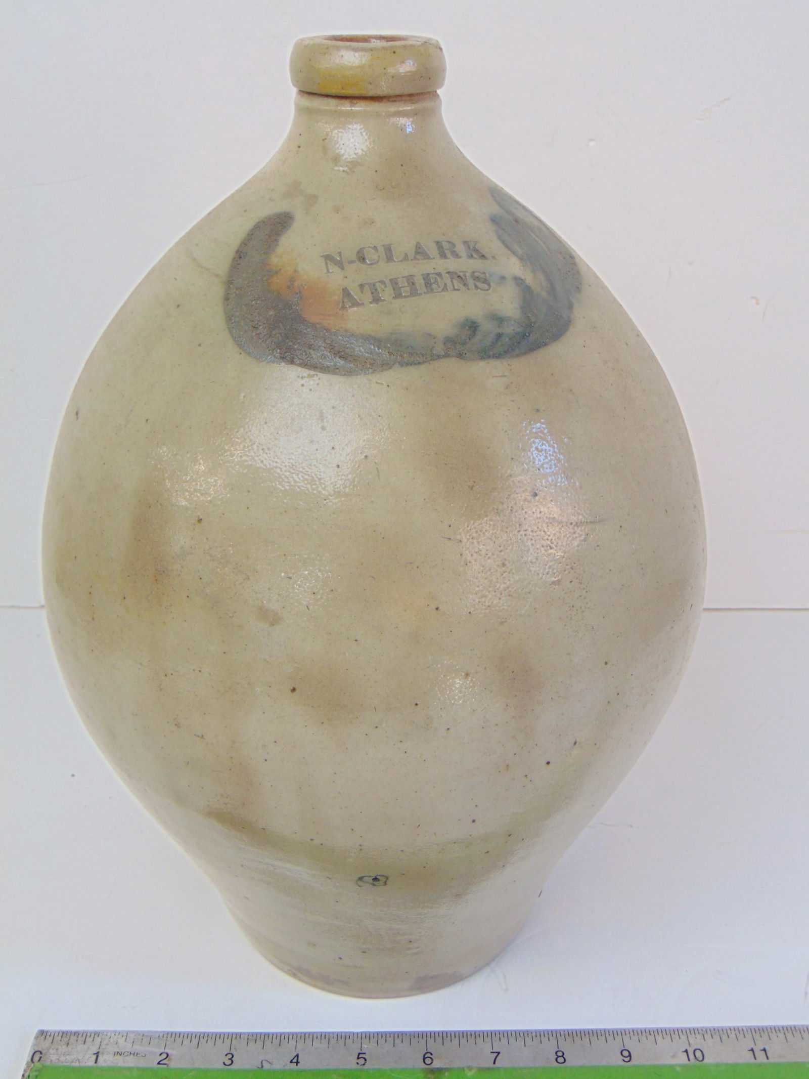 Stoneware ovoid jug, "N. Clark, Athens", blue decoration, height is 14.25", diameter is 9.75" few: Stoneware ovoid jug, "N. Clark, Athens", blue decoration, height is 14.25", diameter is 9.75" few glaze chips.