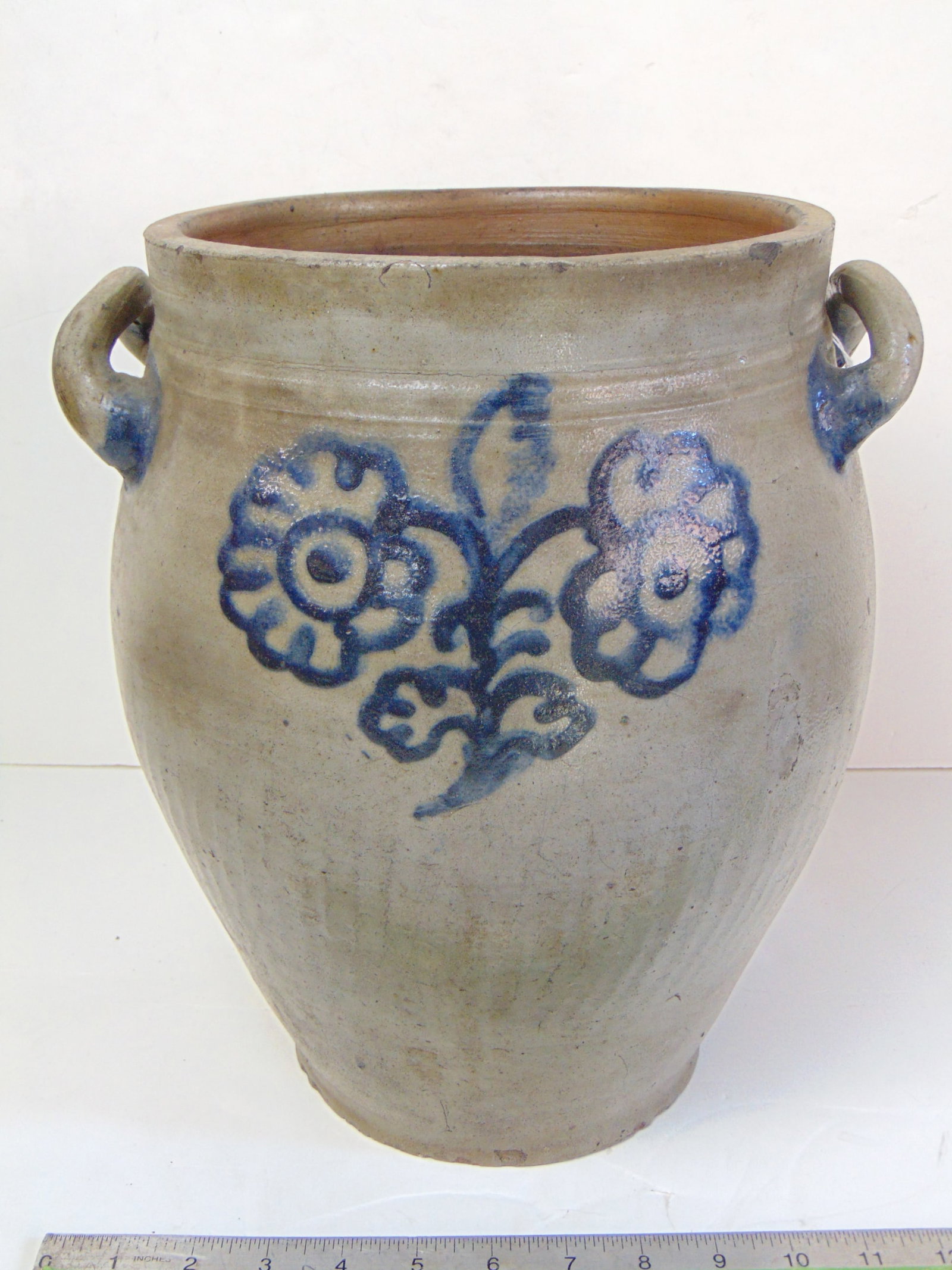 Stoneware jar with blue double flower decoration, open loop handles, ovoid shape, has chip on rim, (1 of 7)