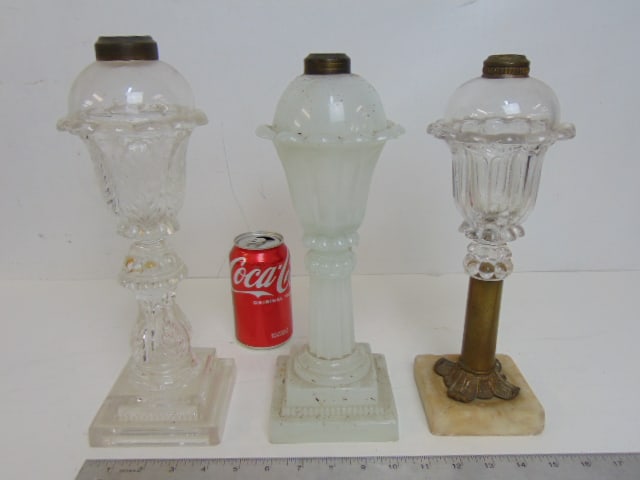 3 whale oil lamps, marble & brass base lamp, frosted white base (chip on side) & clear sandwich: 3 whale oil lamps, marble & brass base lamp, frosted white base (chip on side) & clear sandwich glass base with leaf decoration (large chip, crack on base), heights are 12", 12.25" & 13"