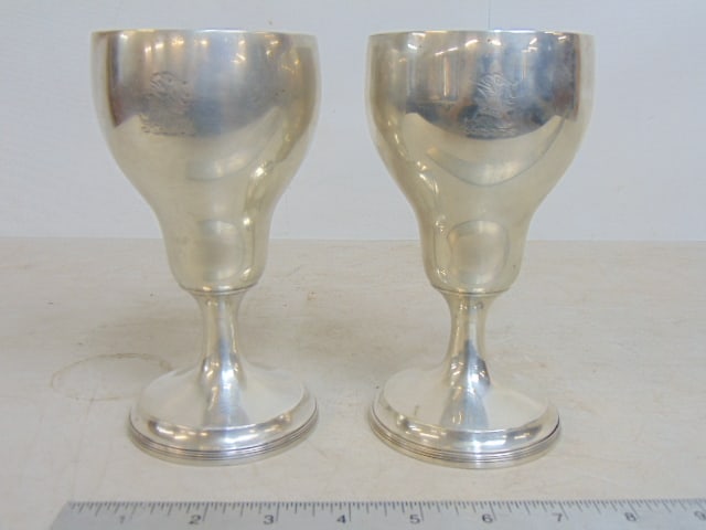 2 sterling silver cups, goblets, engraved with eagle on one side, opposite side "From Bookie" & "To (1 of 4)