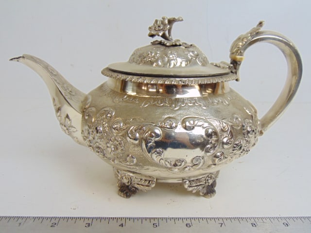 Sterling silver teapot with floral decoration, 22 troy, 10.75 long, handle to tip spout: Sterling silver teapot with floral decoration, 22 troy, 10.75 long, handle to tip spout