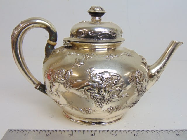 Tiffany & Co Makers sterling silver teapot, decorated with various putti figures, 22 troy, 9.5" (1 of 5)