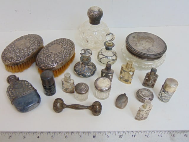 Lot of sterling backed brushes, lidded glass jars, variety of small sterling covered bottles. (1 of 4)