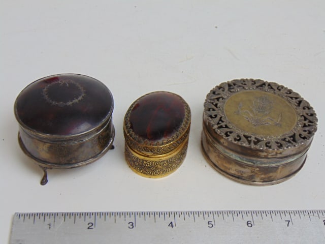 3 small boxes, silver, brass with amber colored lids, 2 round one oval (1 of 9)