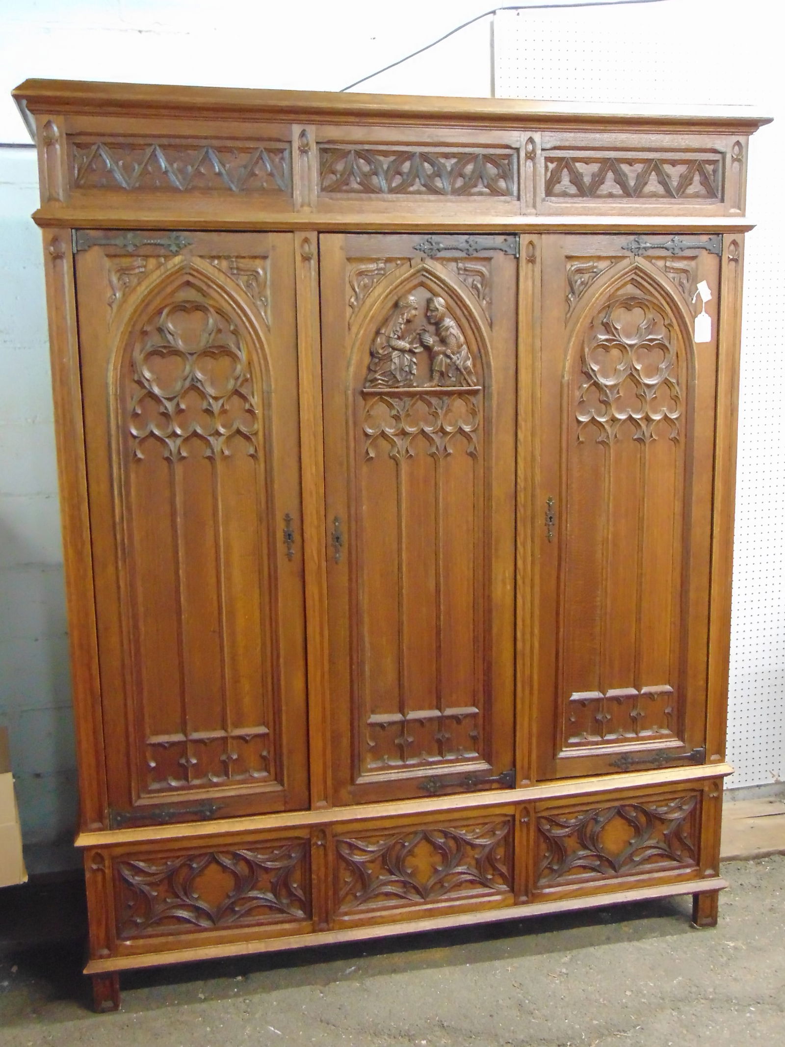 Gothic diminutive Armoire with 3 carved doors, center one featuring Knight proposing to his Lady. (1 of 6)