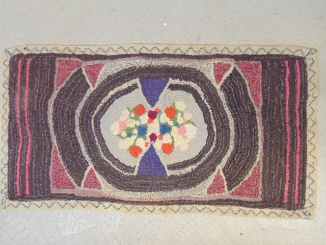 Small hooked rug with center floral pattern, rug is 39.5" by 21" (1 of 4)
