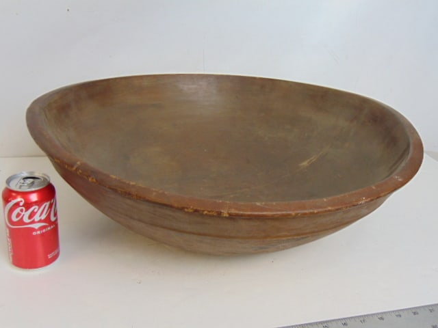 Large wood bowl, repaired, was split at one point, with decorative raised band on exterior, bowl is: Large wood bowl, repaired, was split at one point, with decorative raised band on exterior, bowl is 22 3/8" in diameter, height is 7"