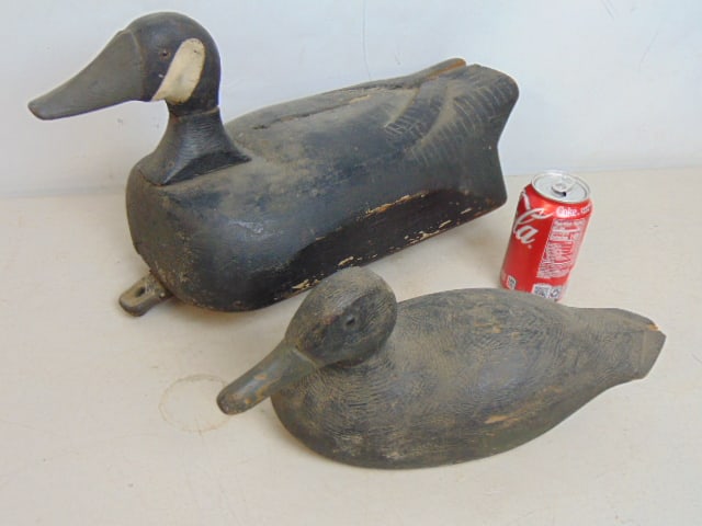 2 duck decoys, one large decoy, black paint with white cheek, carved detail is 19" long, 8.25" wide, (1 of 4)