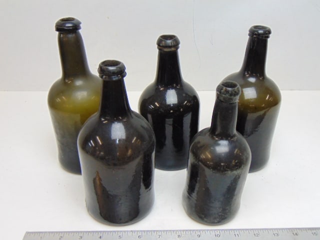 Lot of 5 early green glass bottles, no markings, height ranges from 7.5" to 9.5", all round, one (1 of 5)