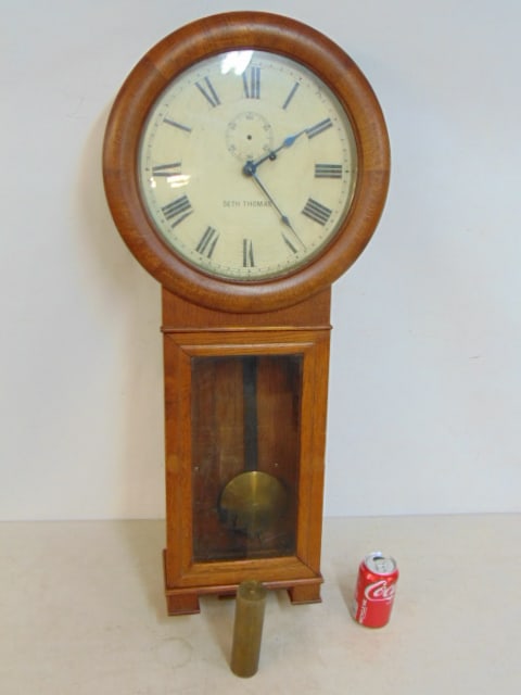 Oak Seth Thomas wall clock, with single brass weight & pendulum, key, second hand missing, untested, (1 of 8)
