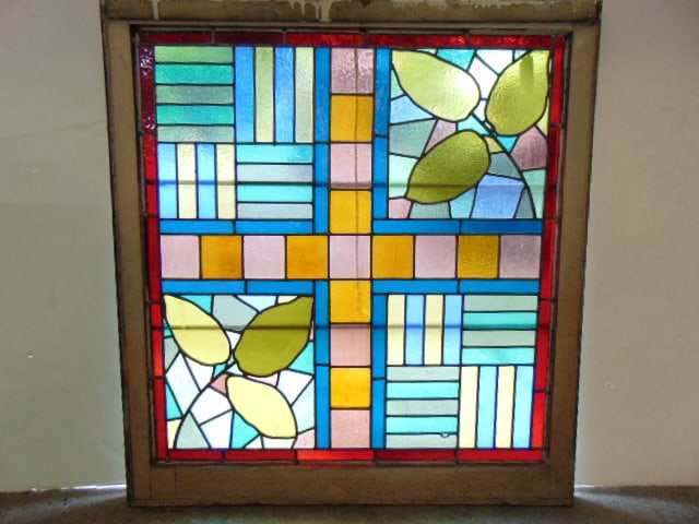 Leaded glass window with leaves & geometric designs, 2 small red panels on edge have cracks, window (1 of 5)