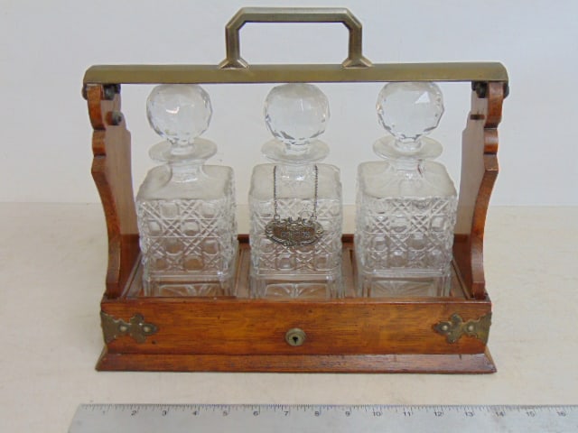 Tantalus set, three crystal decanters with stoppers in oak holder, no key, 14.5" long, 5 5/8" wide, (1 of 4)