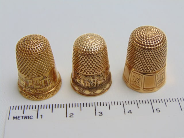 (3) Gold thimbles 18k & 14k, "Mrs. E.D." size 7 tested 18k, 7 grams; "J.L.G. size 7, tested 14k, (1 of 5)