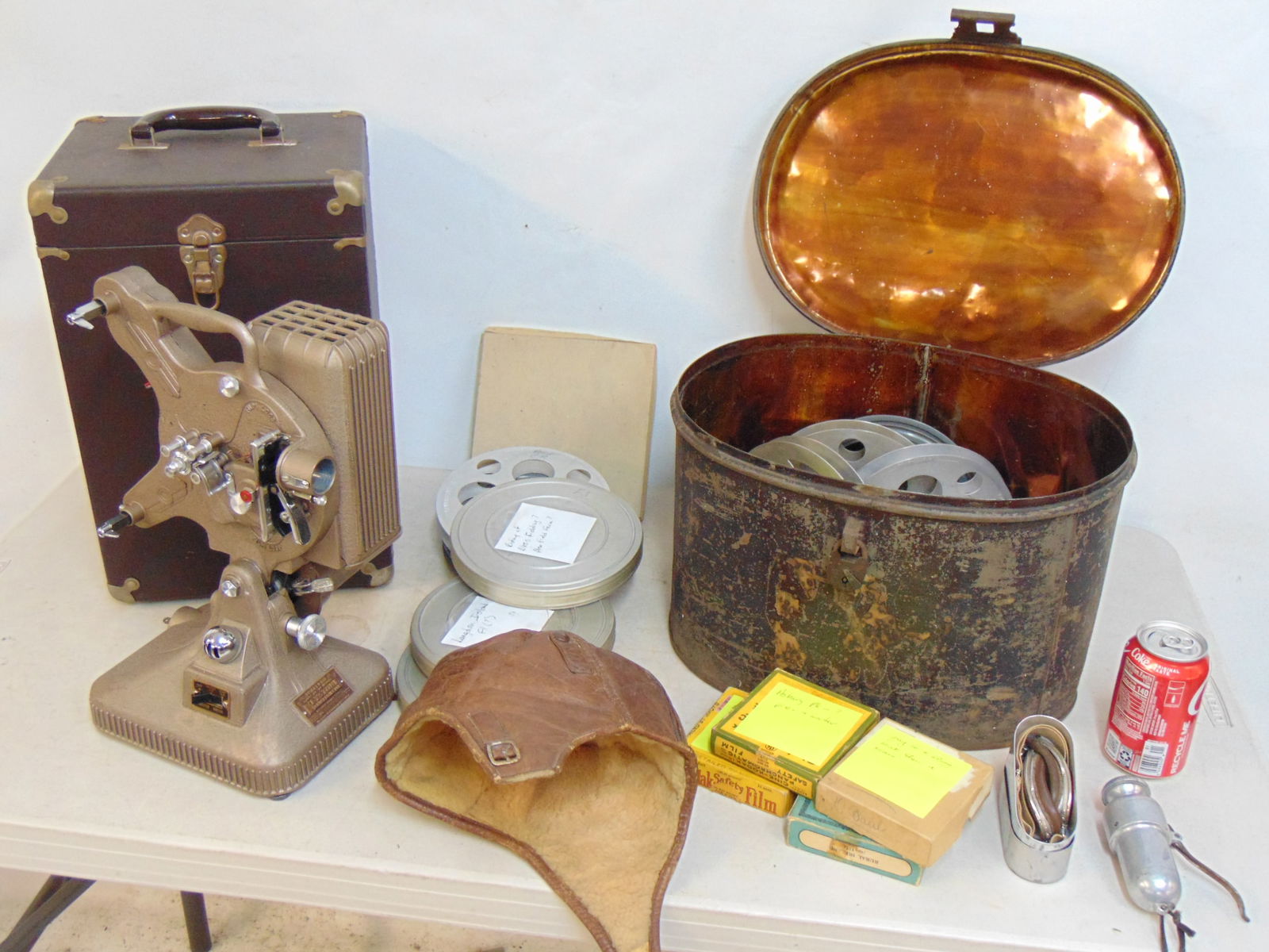 Rare barnstormer biplane lot, early 20th Century, includes films, projector, leather cap, goggles (1 of 16)