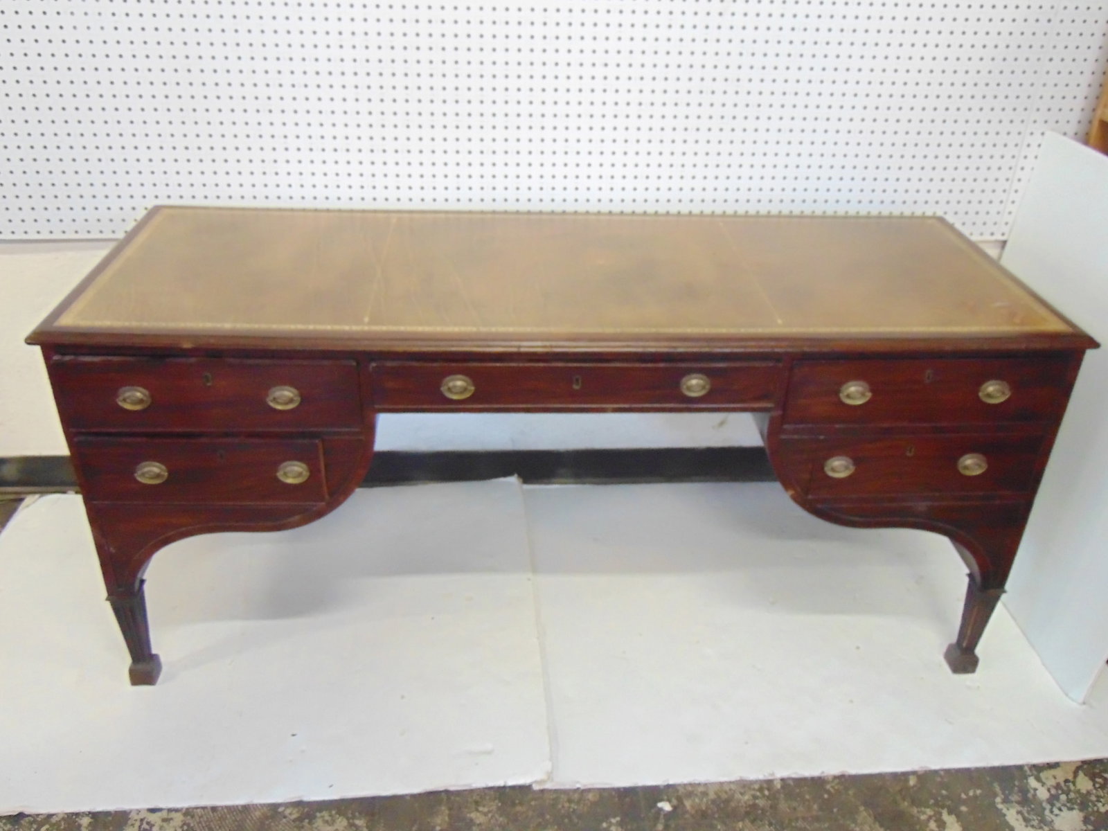 English leather top faux partners desk, has fake drawer fronts on reverse, desk is 25.25" deep, 67.5: English leather top faux partners desk, has fake drawer fronts on reverse, desk is 25.25" deep, 67.5" wide, height is 29.25", some minor veneer chips, leather has wear in front right corner (images)