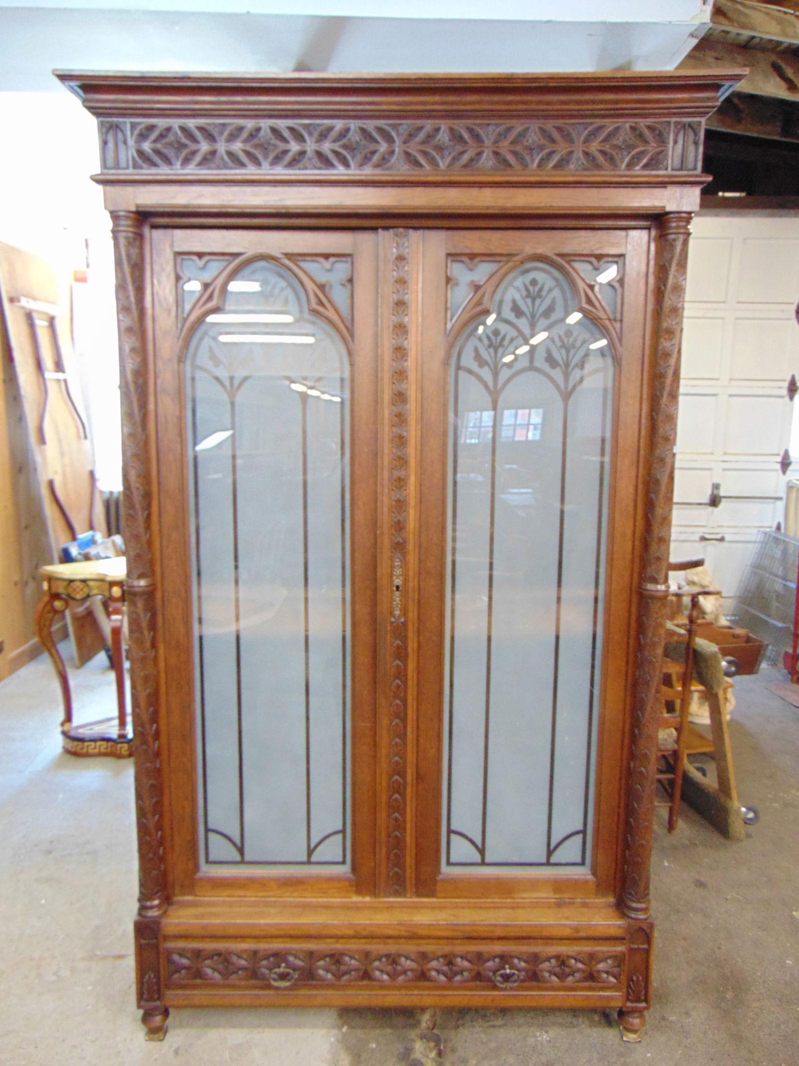 French Gothic revival two door armoire with frosted glass doors, columns decorated with carved leave (1 of 7)