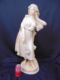 Large carved alabaster statue of a girl holding mandolin while leaning against tree trunk, signed Ce