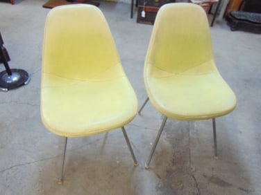 Pair Herman Miller chairs, fiberglass with yellow vinyl covering