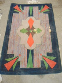 Hooked rug, geometric design, worn, has loss, 81" by 54"