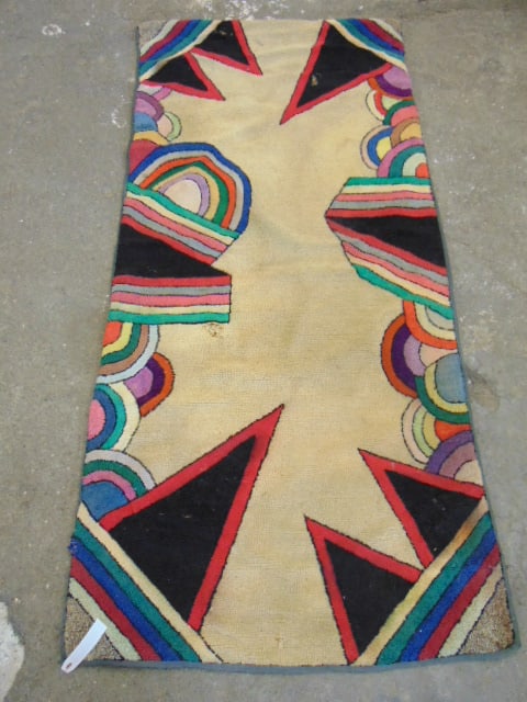Hooked rug, beige field with abstract border, 84" by 37.5": Hooked rug, beige field with abstract border, 84" by 37.5"this has been professionally backed and appears to have significant age. It came to us from the collection of a renowned Folk Art collector an