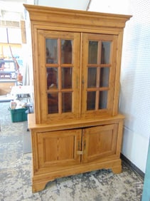 Waxed pine breakfront cabinet