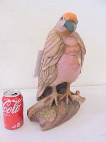 Paint decorated clay bird with watch, signed P. Lee