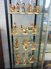 Large group of Hummel figurines. 30 plus