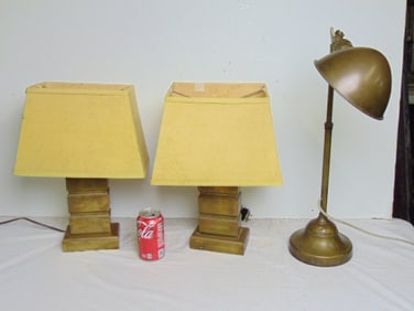 Pair and a single brass lamp
