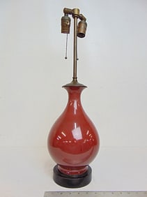 Chinese oxblood table lamp, wood base, wire cut, total height is 23.5", good condition.