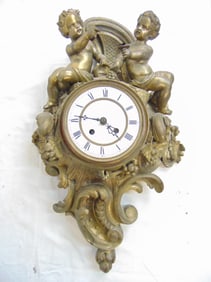 Figural Spelter wall clock with Putti figures, needs restoration, glass missing, clock is 22.5" by