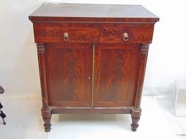 Mahogany altered empire buffet with pull out side, carved legs, cabinet is 37.75" by 24", height is