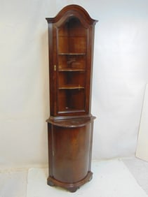 Corner cabinet with curved front base & flat front top section, cabinet is 20.5" wide, 16" deep
