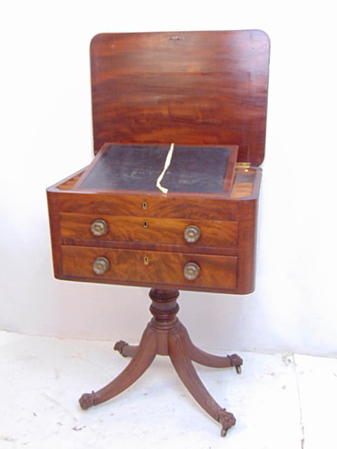 2 drawer mahogany sewing stand, Duncan Phyfe style, two drawers with lift top work area, storage: 2 drawer mahogany sewing stand, Duncan Phyfe style, two drawers with lift top work area, storage section, carved wood claw feet, 22.5" by 16.5", height is 29.5"stand is