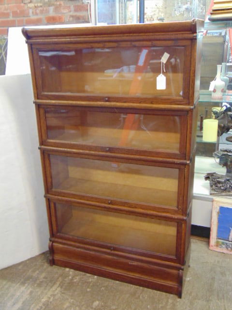 Stack oak barrister bookcase, 4 sections plus base & top, height is 58", some veneer damage top (1 of 4)
