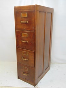 Oak 4 drawer file cabinet, paneled sides, cabinet is 27 5/8" deep, 16" wide, height is 53"