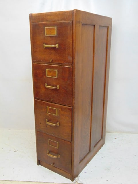Oak 4 drawer file cabinet, paneled sides, cabinet is 27 5/8" deep, 16" wide, height is 53" (1 of 3)