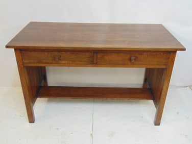 Oak Arts & Crafts spindle sides desk with 2 drawers, 50" by 24", height is 30"