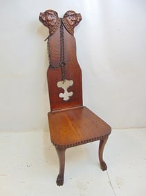 Oak novelty chair with carved dogs, iron chain, chair is 18.5" by 18" (seat), height is 48"