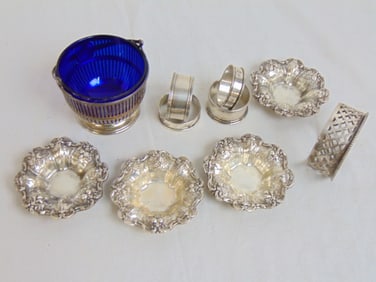 Sterling lot, napkin rings, 4 fancy nut dishes, reticulated sugar bowl with cobalt glass insert, 11