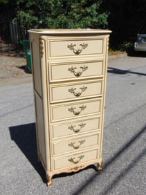 7 drawer lingerie chest, in white paint with gilt highlights, chest is 55.5" tall, 17" deep, 24"
