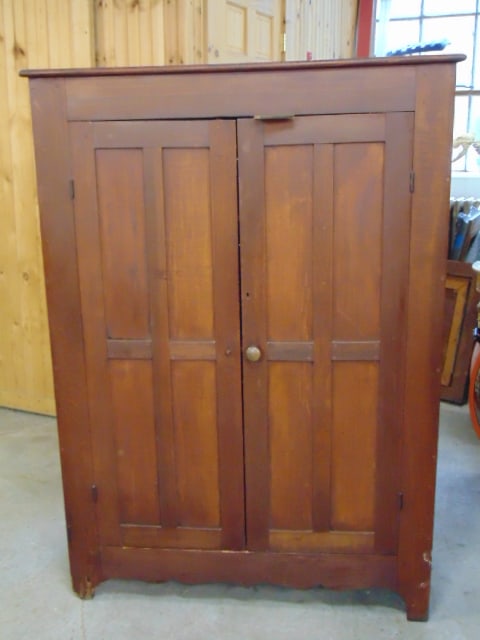 2 door cupboard, paneled doors, wood shelves, bottom shelf partially missing, front left leg shows: 2 door cupboard, paneled doors, wood shelves, bottom shelf partially missing, front left leg shows loss, cabinet is 64" tall, 45.5" wide, 19" deep